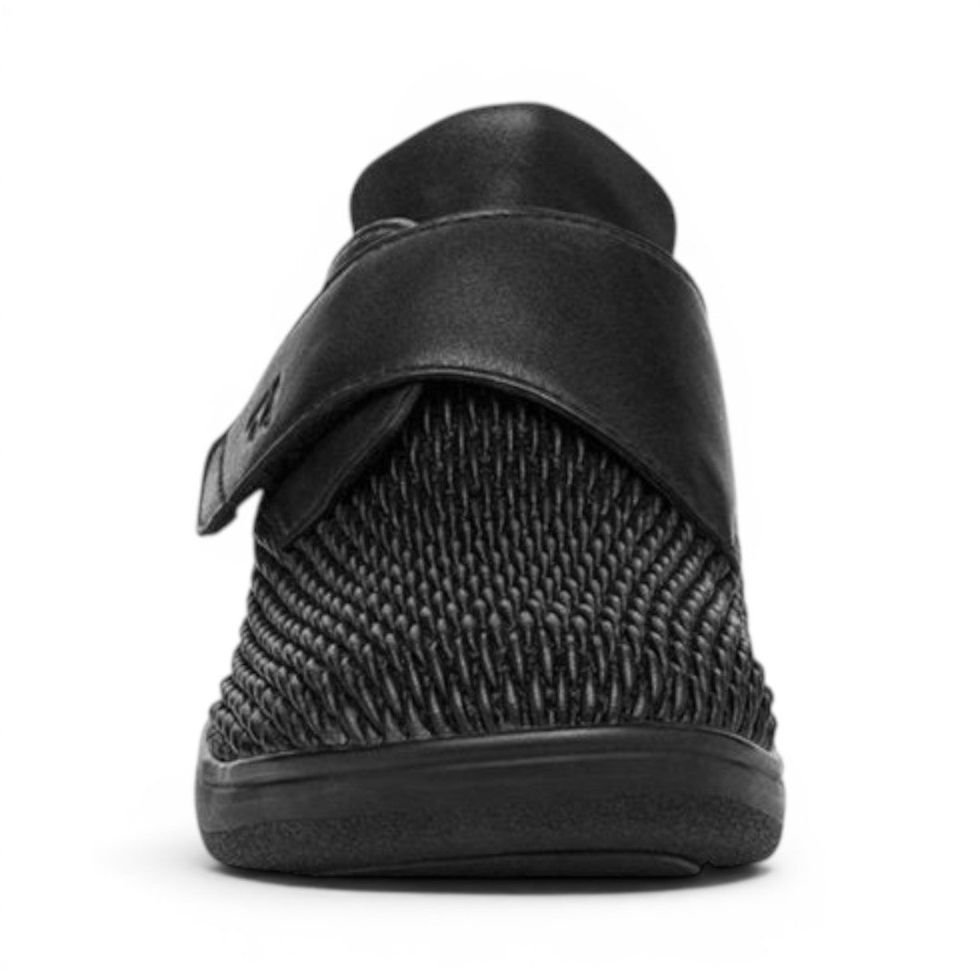 The Happy Shoe Shop Propet Olivia Stretch Shoe in black leatherette with a woven textured heel and adjustable velcro strap.