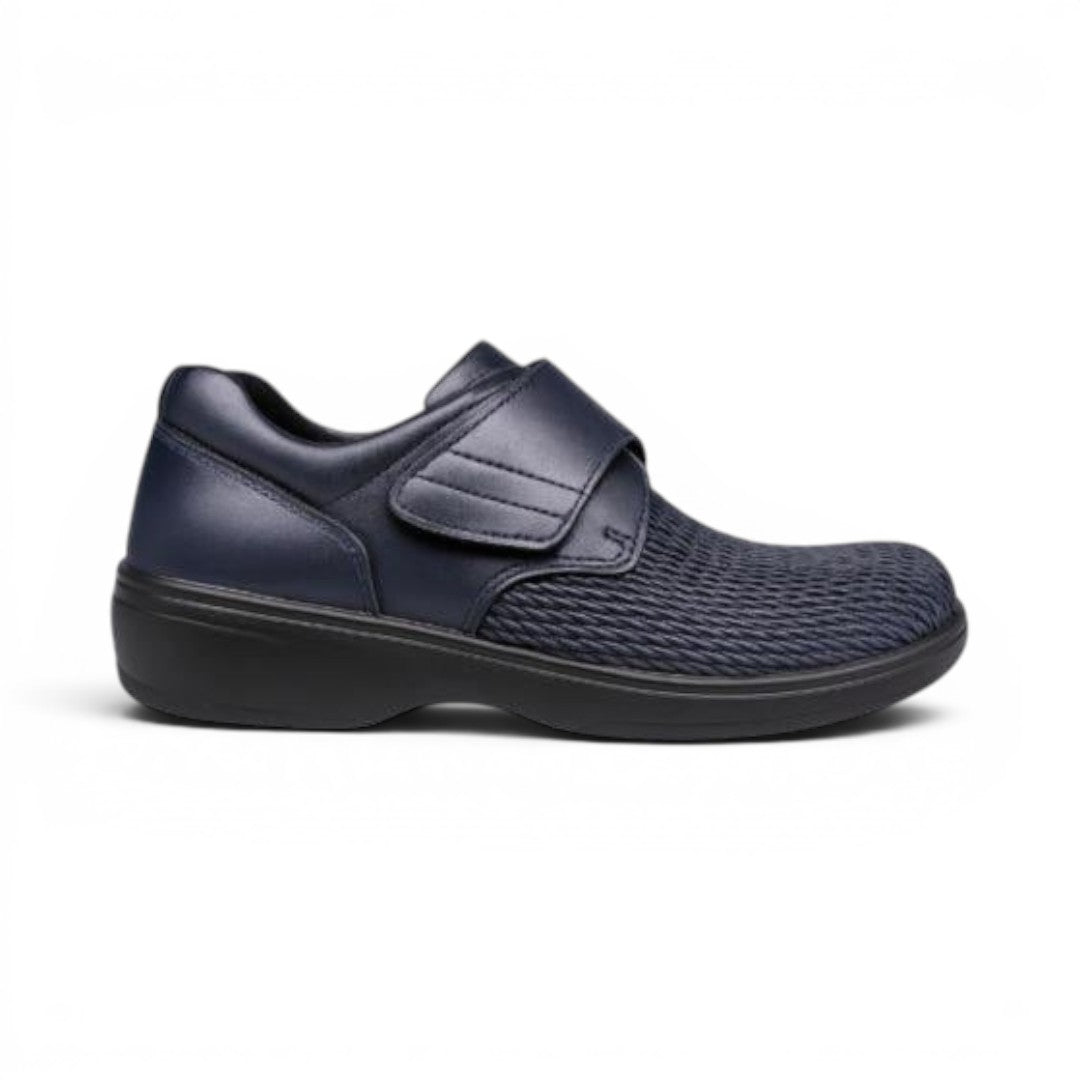 The Happy Shoe Shop Propet Olivia Stretch Shoe in navy blue leatherette with velcro strap and textured toe box.