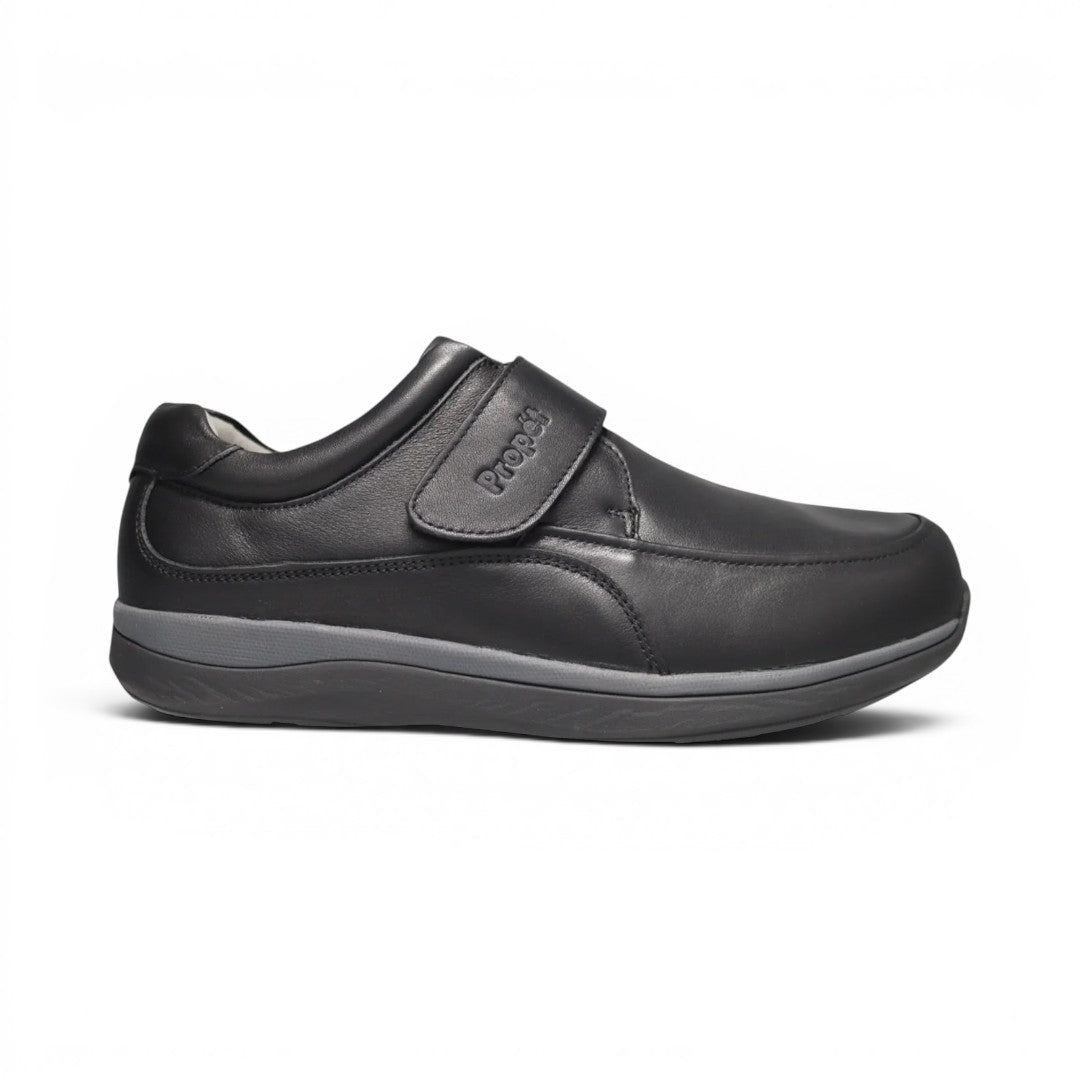 The Happy Shoe Shop Propet Parker men's black leather shoe with adjustable velcro strap and wide 3E width.