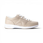 The Happy Shoe Shop Propet Washable Walker women's beige leather sneakers with white laces and soles. Features perforated details and a low-top design.