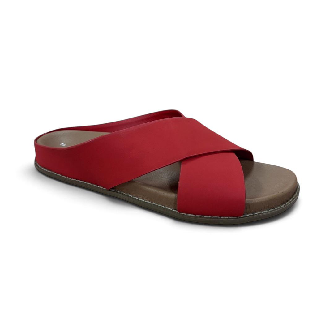 The Happy Shoe Shop Bay Lane Mystic red criss-cross slides with a cushioned brown footbed and non-slip sole.