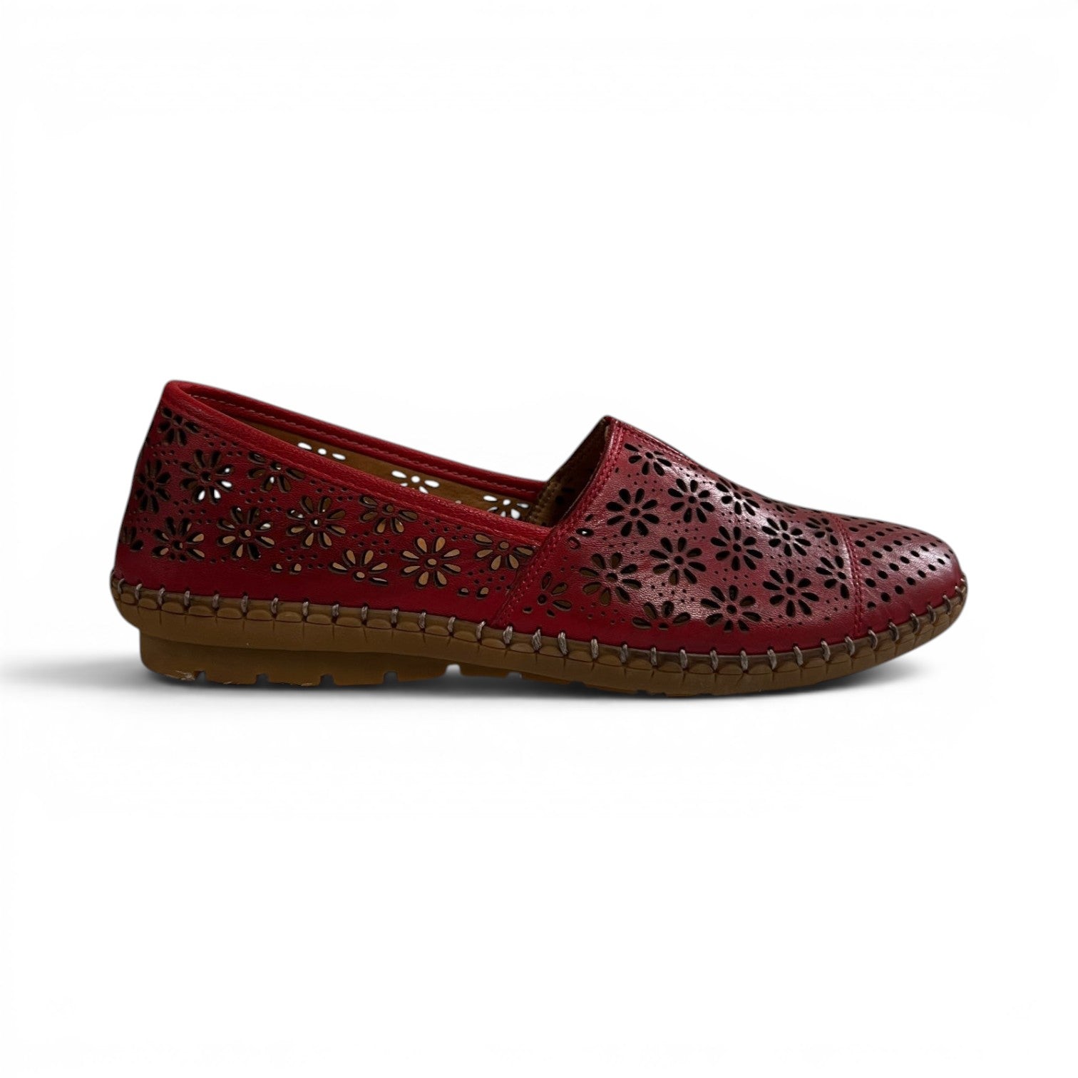 The Happy Shoe Shop Cabello Kylie red leather slip-on shoe with floral laser-cut perforations and rubber sole.