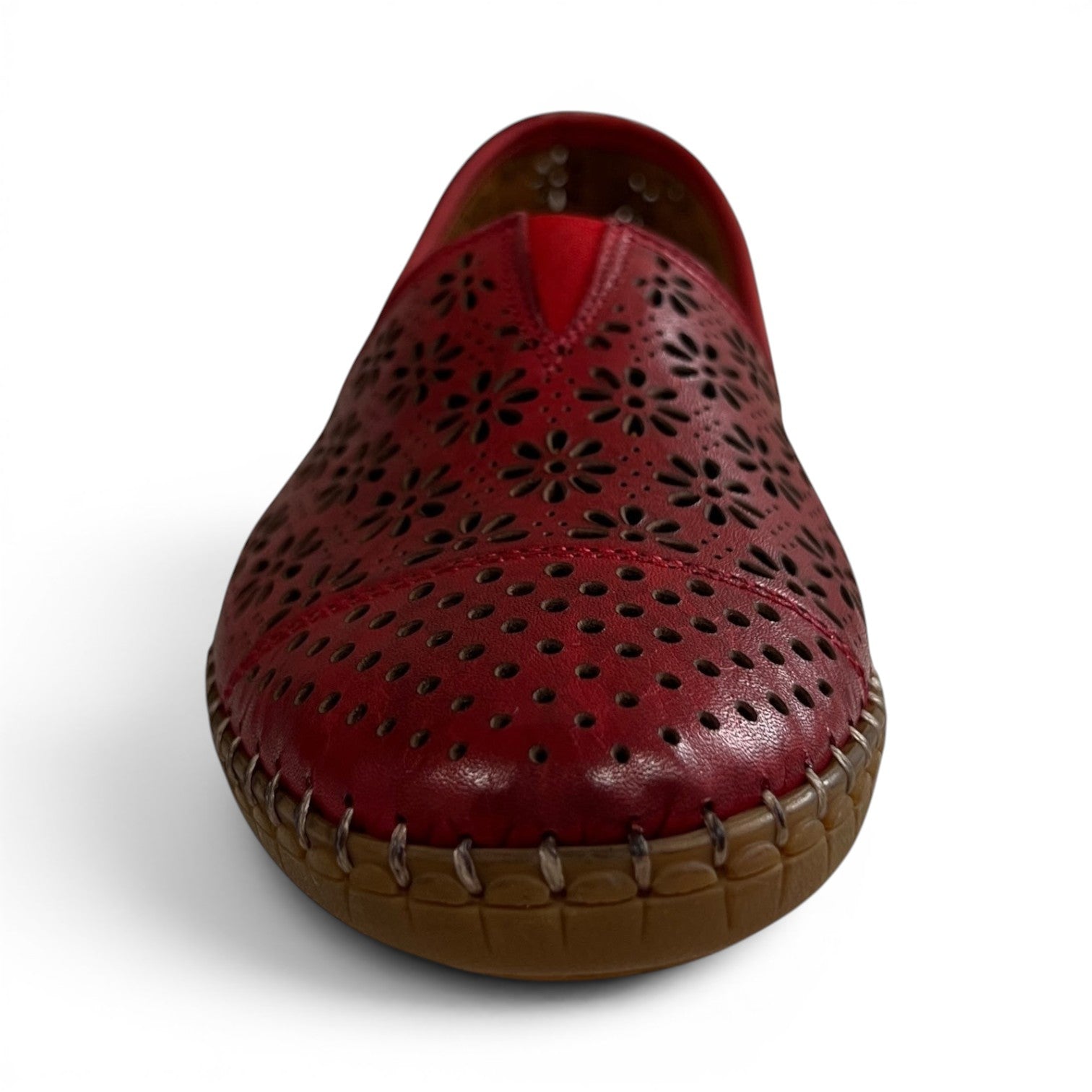 The Happy Shoe Shop Cabello Kylie red leather slip-on shoe with floral laser-cut perforations and flexible rubber sole.