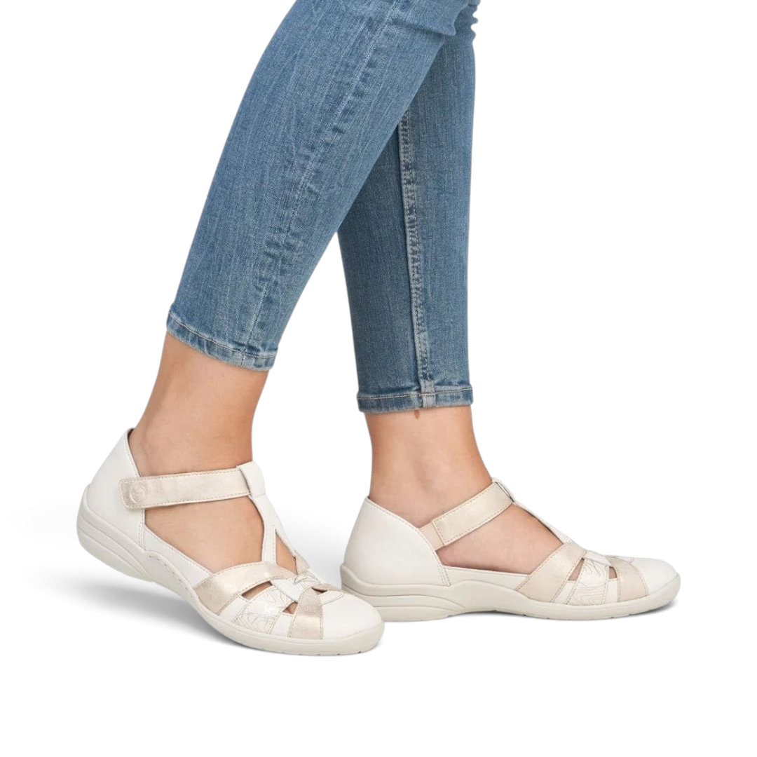 The Happy Shoe Shop Remonte R7601-81 white closed-toe T-bar sandals with cut-out details and adjustable velcro strap.