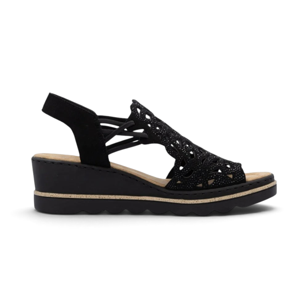 The Happy Shoe Shop Rieker 67465 black wedge sandal with intricate cut-out textile upper and cushioned insole.