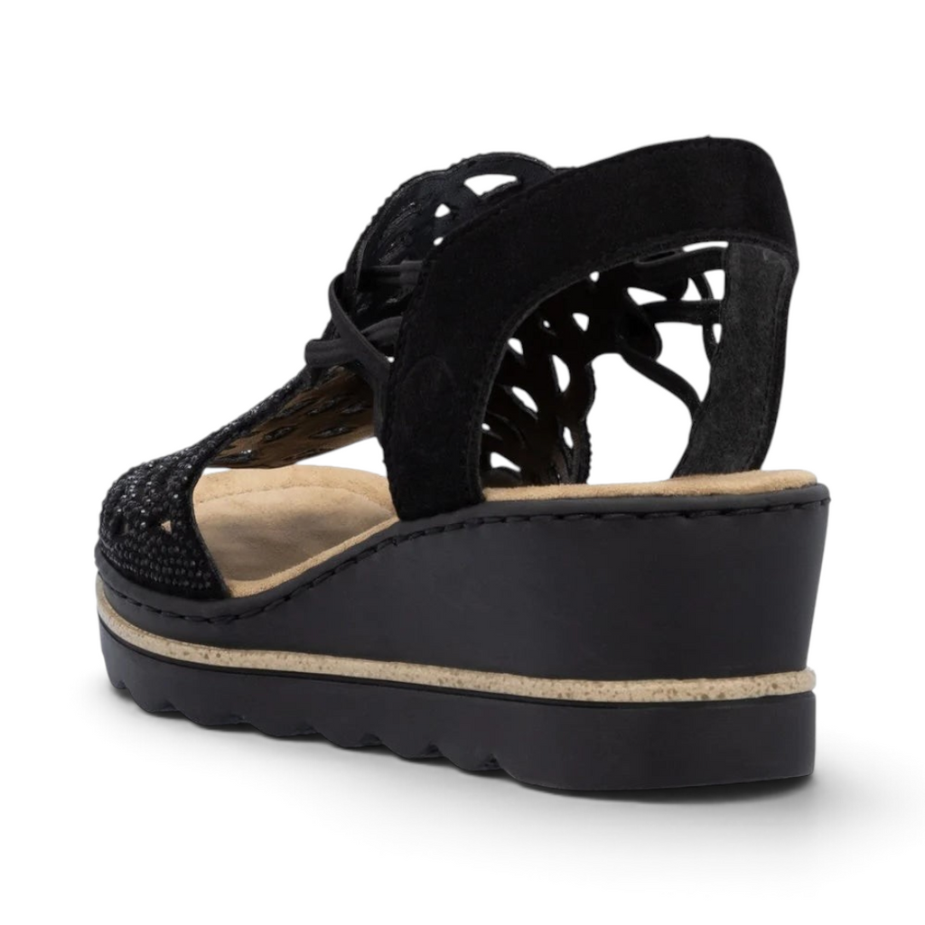 The Happy Shoe Shop Rieker black wedge sandal with intricate cut-out textile upper and cushioned insole