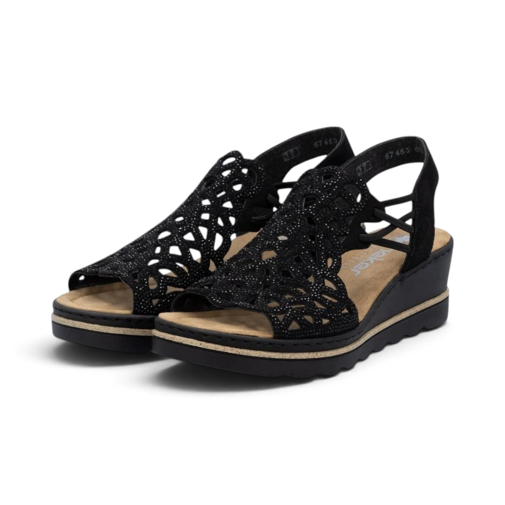 The Happy Shoe Shop Rieker black wedge sandals with intricate cut-out textile upper and cushioned insole