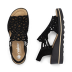The Happy Shoe Shop Rieker 67465 black wedge sandals with intricate cut-out textile upper and cushioned insole.