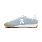 The Happy Shoe Shop Rieker blue textile sneaker with white R logo, white laces, and a gum rubber outsole.