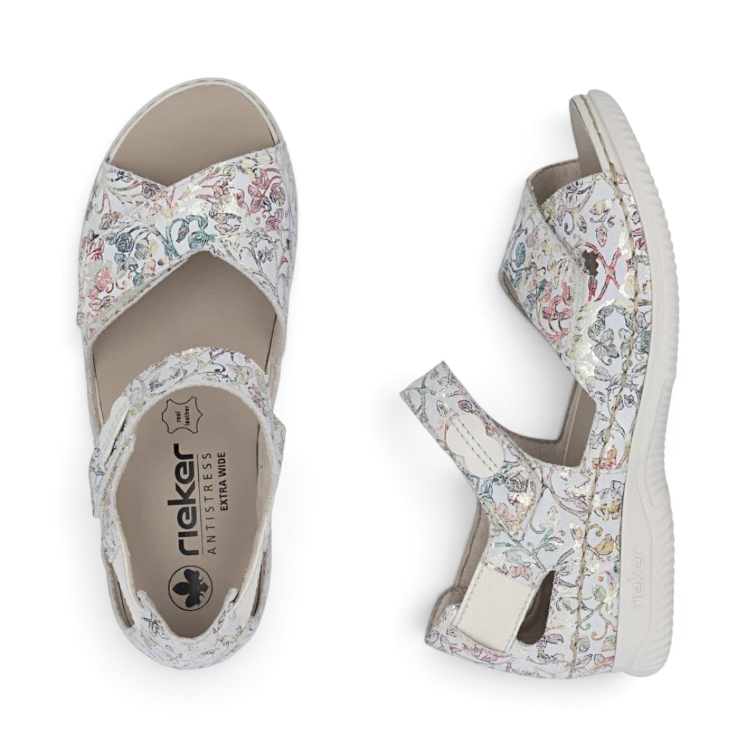 The Happy Shoe Shop Rieker V7474 multicolour floral suede sandals with hook and loop straps and extra-wide fit.