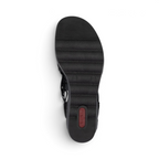 The Happy Shoe Shop Rieker 67465 wedge sandal showing the black textured Riricon outsole from a bottom view.