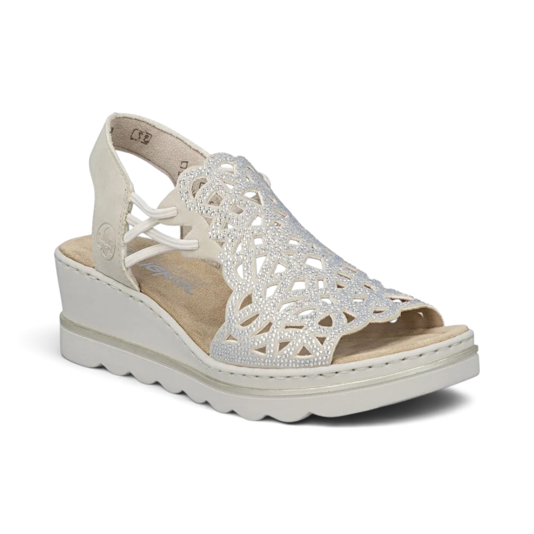 The Happy Shoe Shop Rieker wedge sandal in off-white with intricate laser-cut textile upper and cushioned insole.