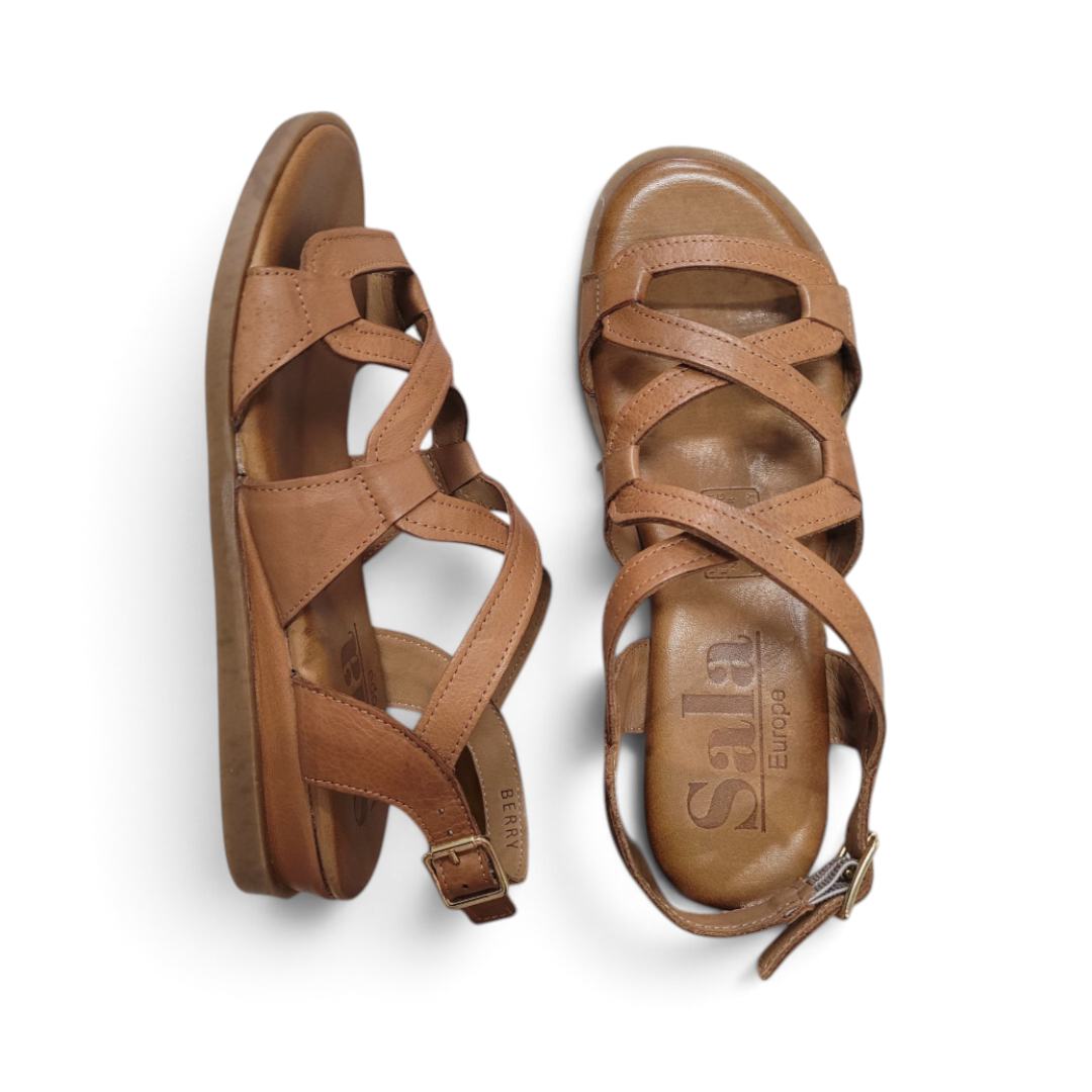 The Happy Shoe Shop Sala Berry women's tan leather flat sandals with delicate crisscross straps and buckle closure.