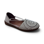 The Happy Shoe Shop Sala Reed flats in white leather with intricate laser-cut circular patterns and a brown sole.