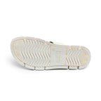 The Happy Shoe Shop Soultbush Mission sandal in bone, showing the textured wavy tread pattern on the white sole.