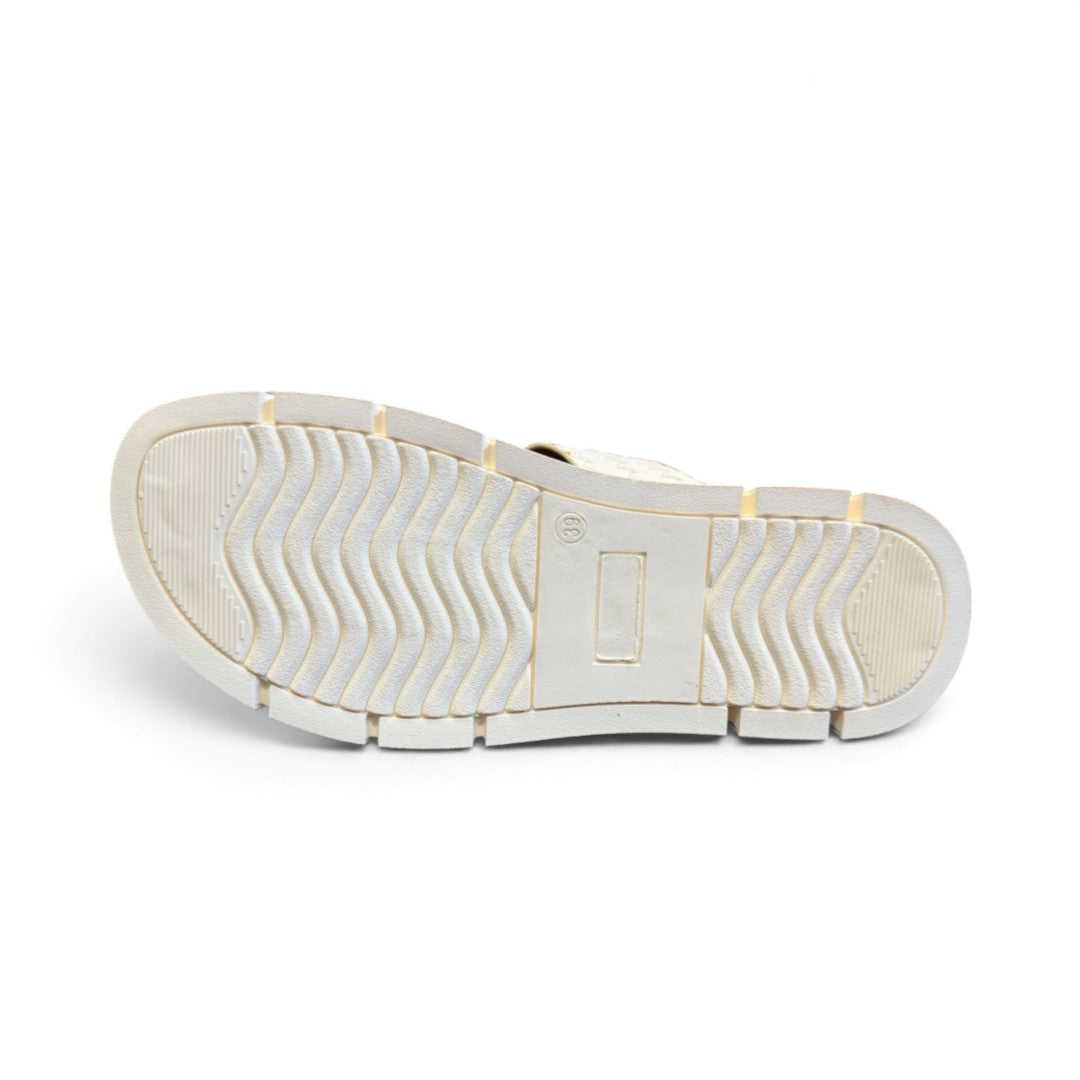The Happy Shoe Shop Soultbush Mission sandal in bone, showing the textured wavy tread pattern on the white sole.