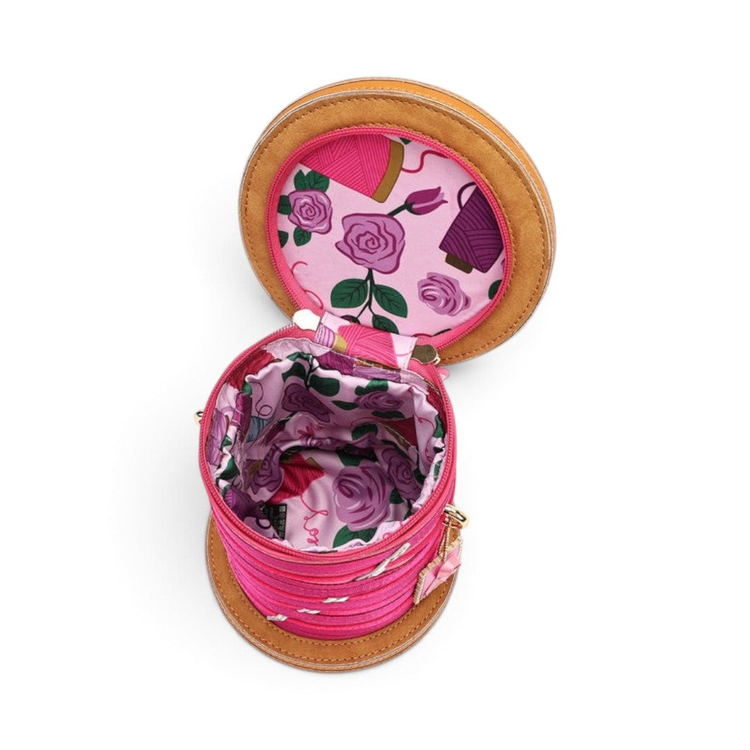 The Happy Shoe Shop Vendula London sewing box bag in raspberry with floral lining and cotton reel design