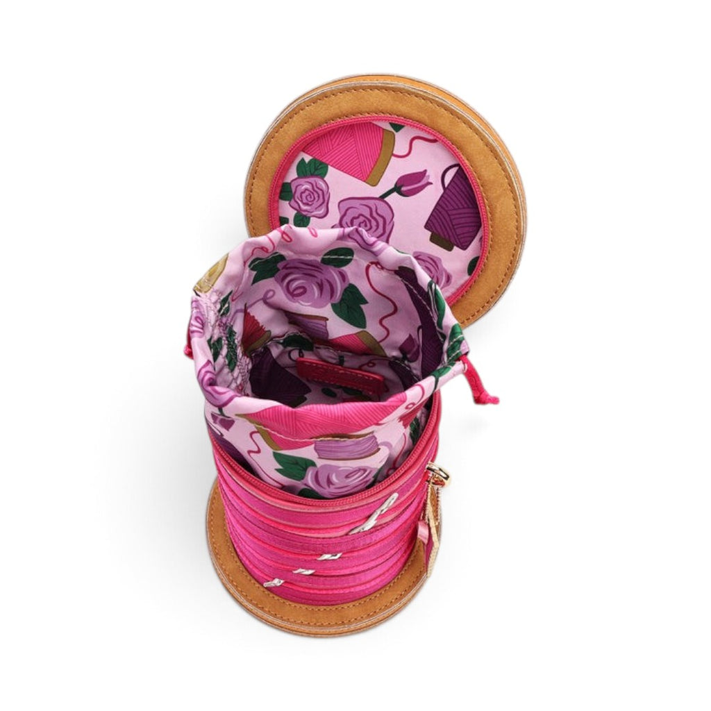 The Happy Shoe Shop Vendula London sewing box bag with pink floral drawstring lining and thread reel design