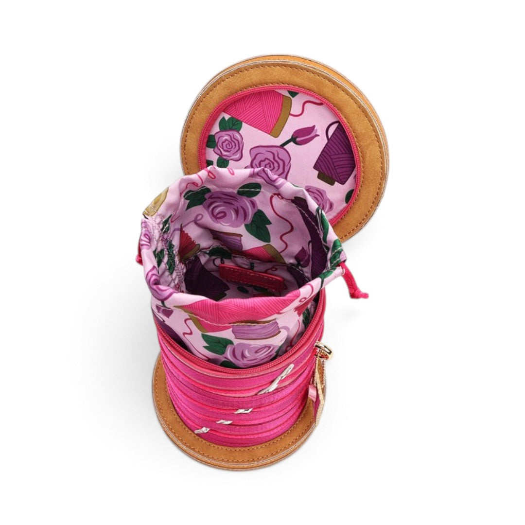 The Happy Shoe Shop Vendula London sewing box bag with pink floral drawstring lining and thread reel design