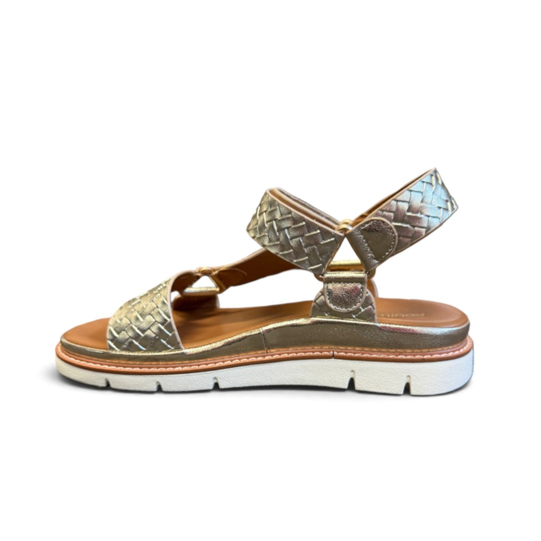 The Happy Shoe Shop Soultbush Harbour sandal in metallic gold with a woven texture, tan footbed, and white sole.
