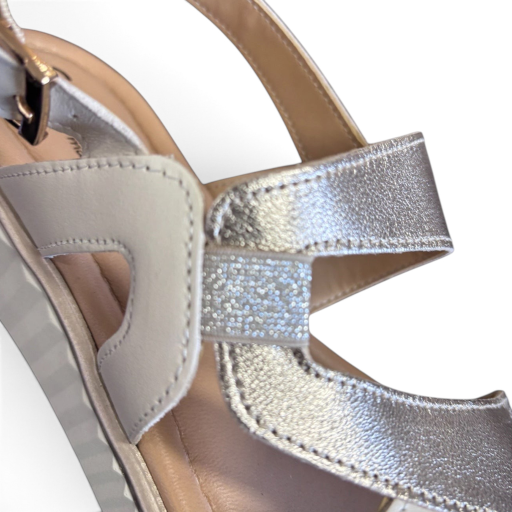 The Happy Shoe Shop Sundowner Satina sandal featuring metallic silver multi-strap design and adjustable ankle buckle.