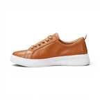 The Happy Shoe Shop Le Sansa Nelly tan leather sneakers with white platform midsole and lace-up design.