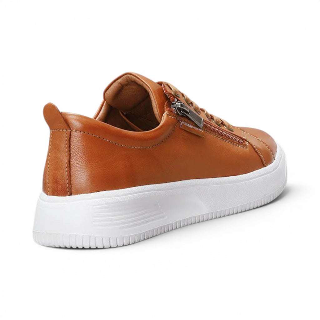 The Happy Shoe Shop Le Sansa Nelly tan leather sneakers with side zip detail and white platform sole, rear view.