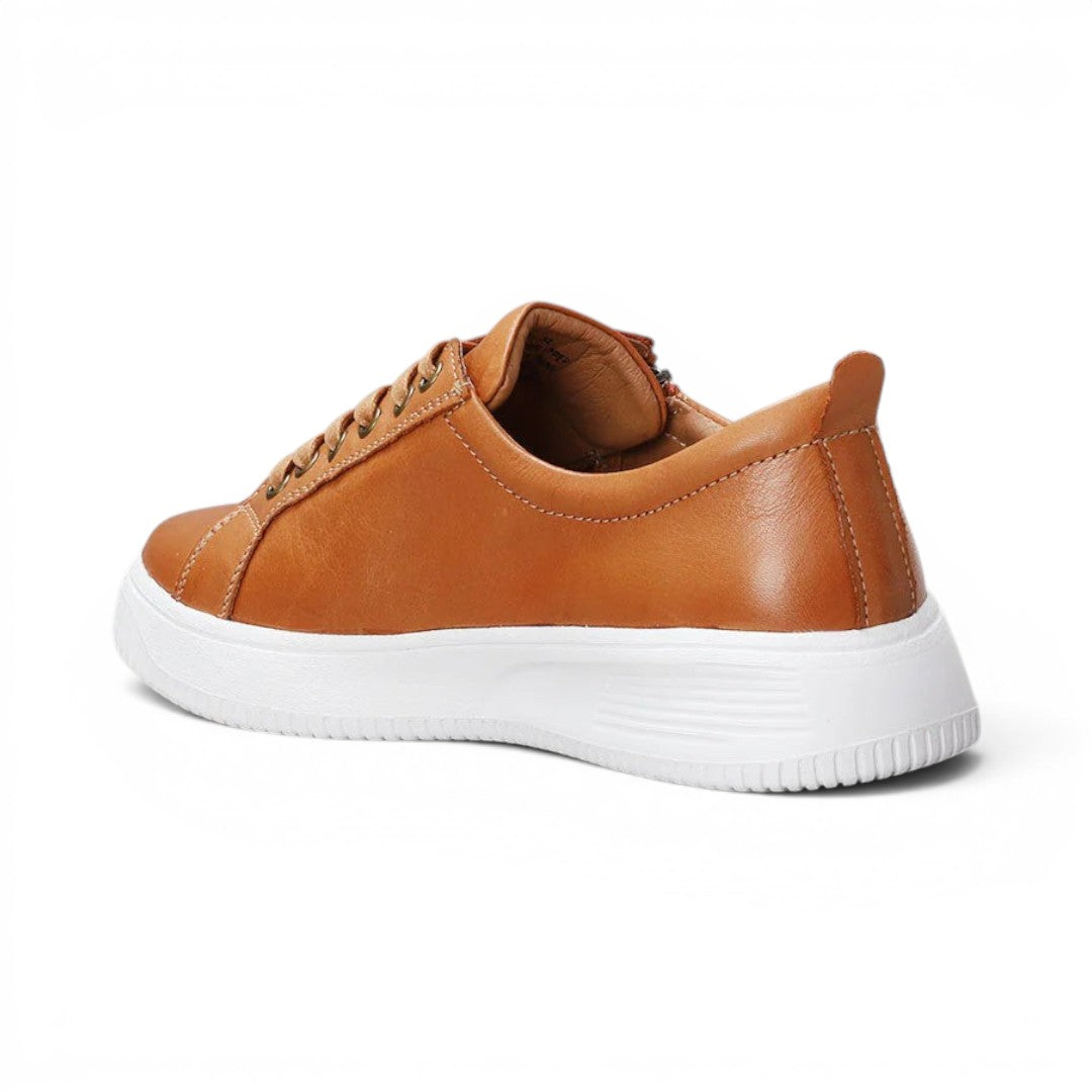 The Happy Shoe Shop Nelly tan leather sneakers with a white platform midsole and orthotic-friendly design.