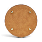 The Happy Shoe Shop Vendula London sewing box bag base showing four gold protective metal feet on tan vegan leather.