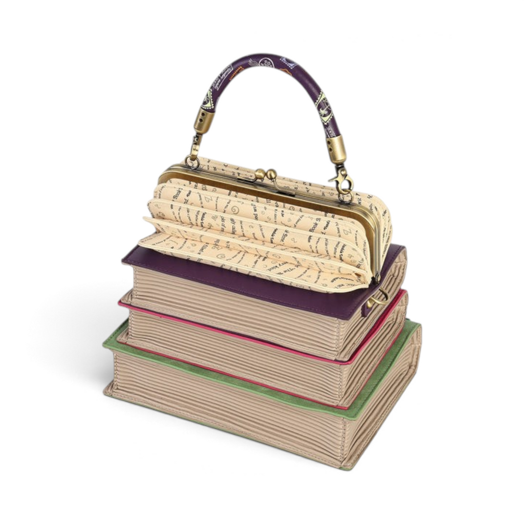 The Happy Shoe Shop Vendula London book stack handbag in vegan leather with a clip-frame concertina top opening.