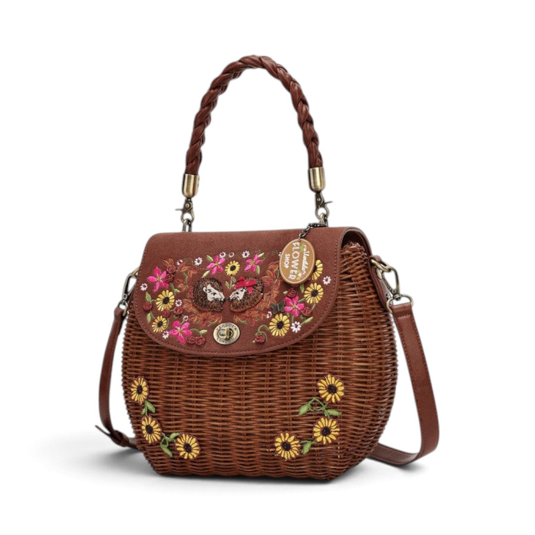 The Happy Shoe Shop Vendula London amber wicker basket bag with sunflower embroidery and vegan leather flap