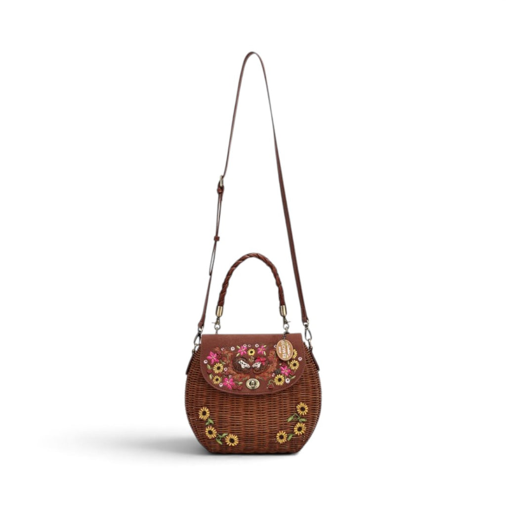 The Happy Shoe Shop Vendula London amber wicker basket bag with floral embroidery and vegan leather flap