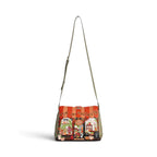 The Happy Shoe Shop Vendula Flower Shop Alice Bag in amber vegan leather with intricate floral appliqué and embroidery.