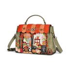 The Happy Shoe Shop Vendula London Flower Shop Mini Grace Bag in amber vegan leather with floral and shopfront details.