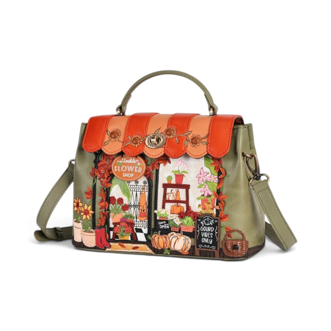 The Happy Shoe Shop Vendula London Flower Shop Mini Grace Bag in amber vegan leather with floral and shopfront details.