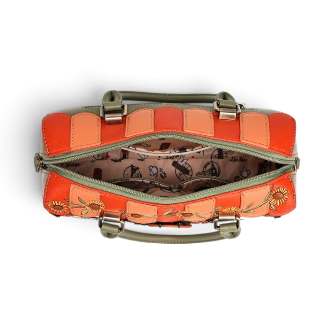 Top view of The Happy Shoe Shop Vendula London Flower Shop bowler bag in orange and green vegan leather with lining.