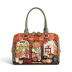 The Happy Shoe Shop Vendula London Flower Shop bowler bag in amber vegan leather with floral and autumn motifs.