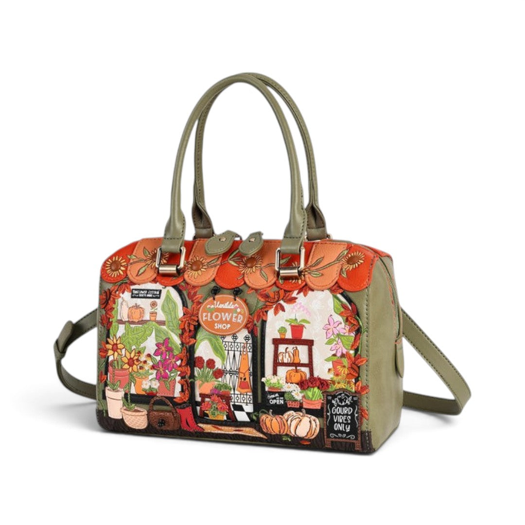 The Happy Shoe Shop Vendula London flower shop bowler bag in vegan leather with autumn sunflower and pumpkin print.