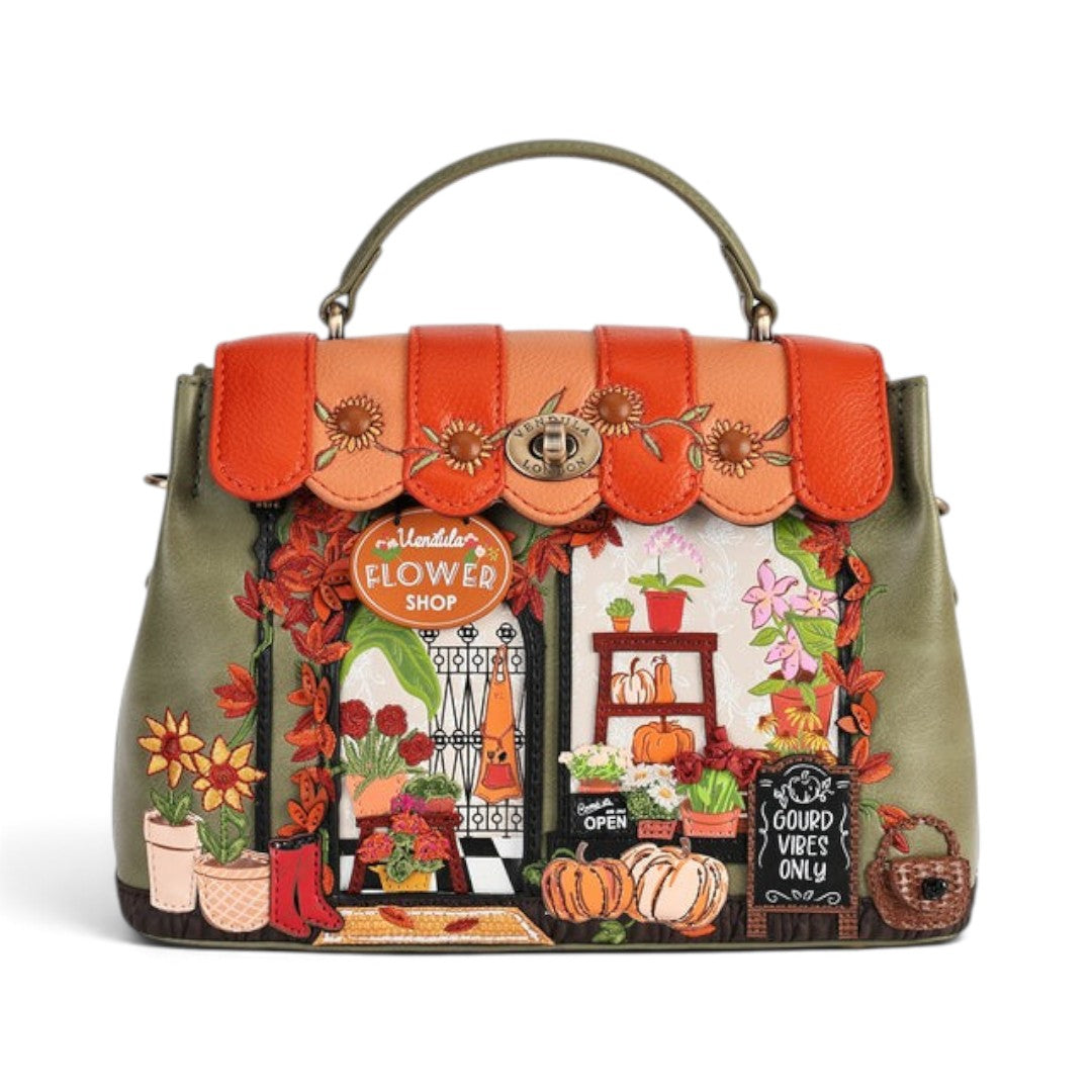 The Happy Shoe Shop Vendula London Flower Shop Mini Grace Bag in amber vegan leather with intricate floral embroidery.