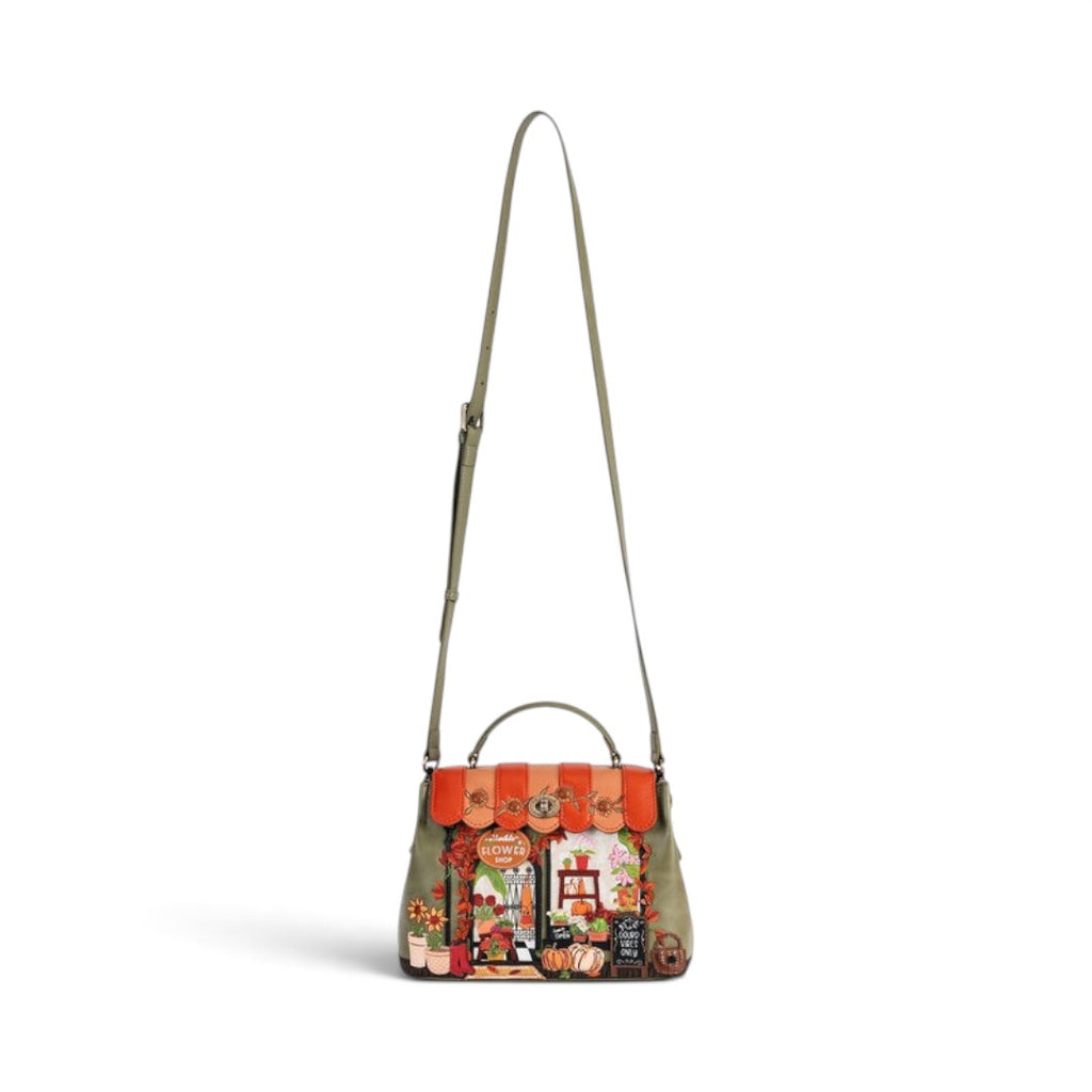 The Happy Shoe Shop Vendula London Flower Shop Mini Grace Bag in amber vegan leather with floral and shop front detail.
