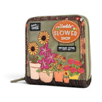 The Happy Shoe Shop Vendula London flower shop square wallet in amber with embossed floral and shop front details.