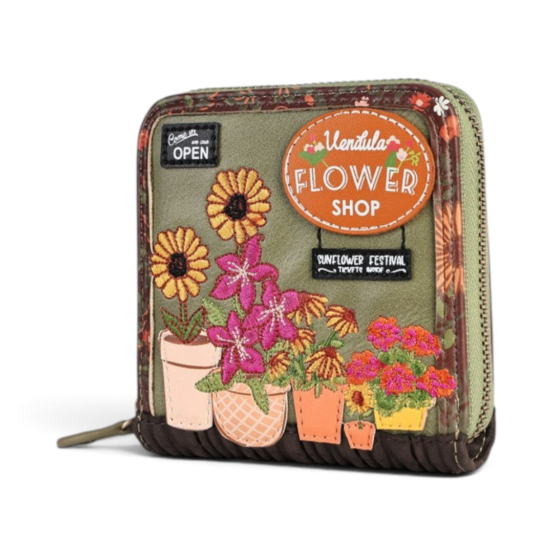 The Happy Shoe Shop Vendula London flower shop square wallet in amber with embossed floral and shop front details.