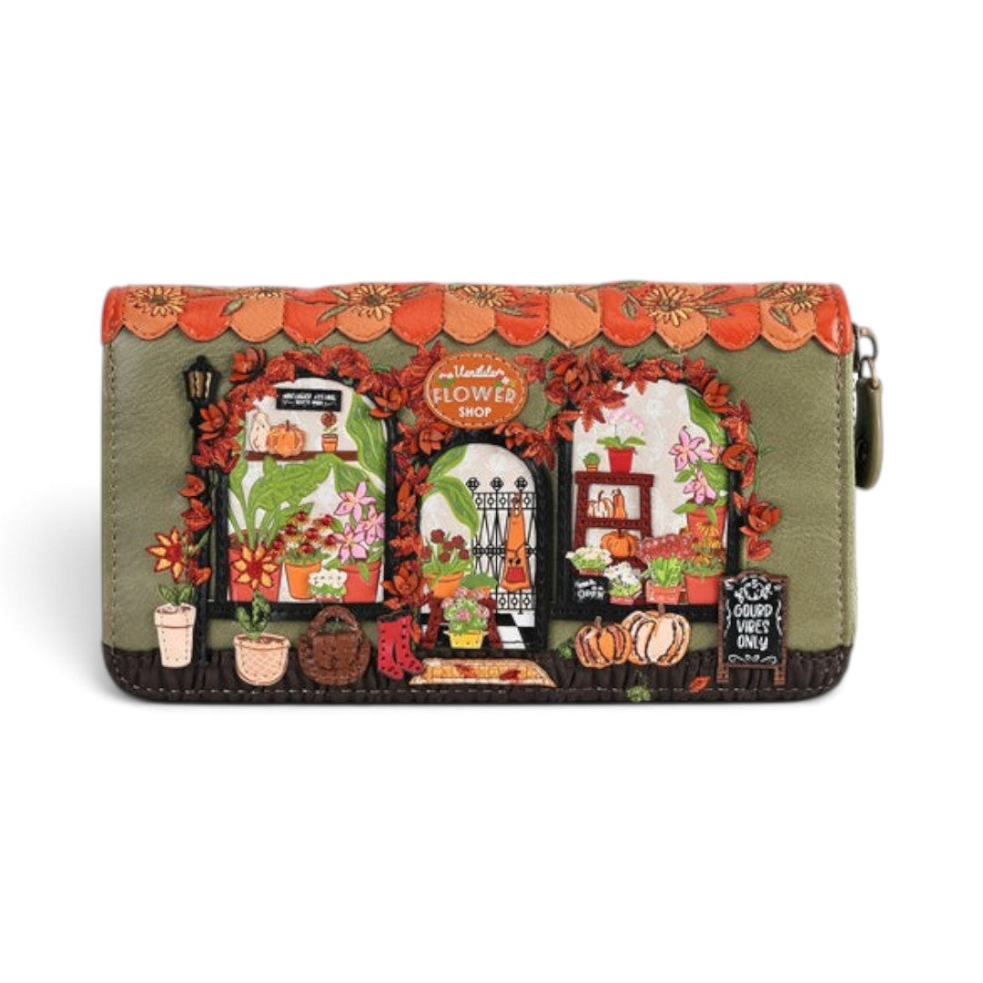 The Happy Shoe Shop Vendula London Flower Shop wallet in amber vegan leather with embossed floral and shop details.