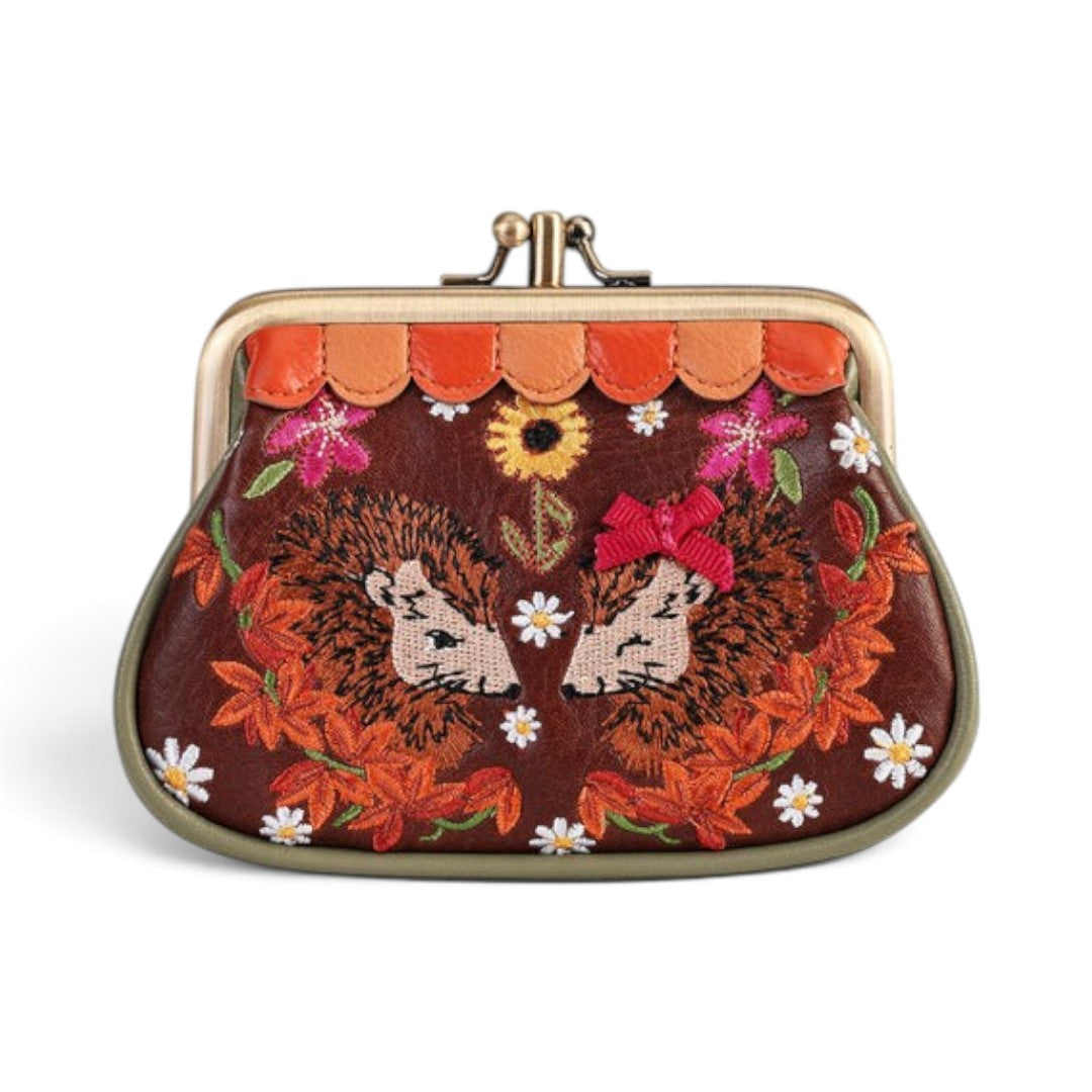 The Happy Shoe Shop Vendula London vegan leather coin purse featuring embroidered hedgehogs and autumn floral details.