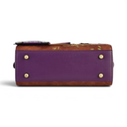 The Happy Shoe Shop Vendula London bowler bag base featuring purple vegan leather, gold protective feet, and stitching.