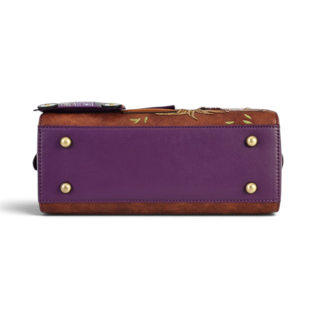 The Happy Shoe Shop Vendula London bowler bag base featuring purple vegan leather, gold protective feet, and stitching.