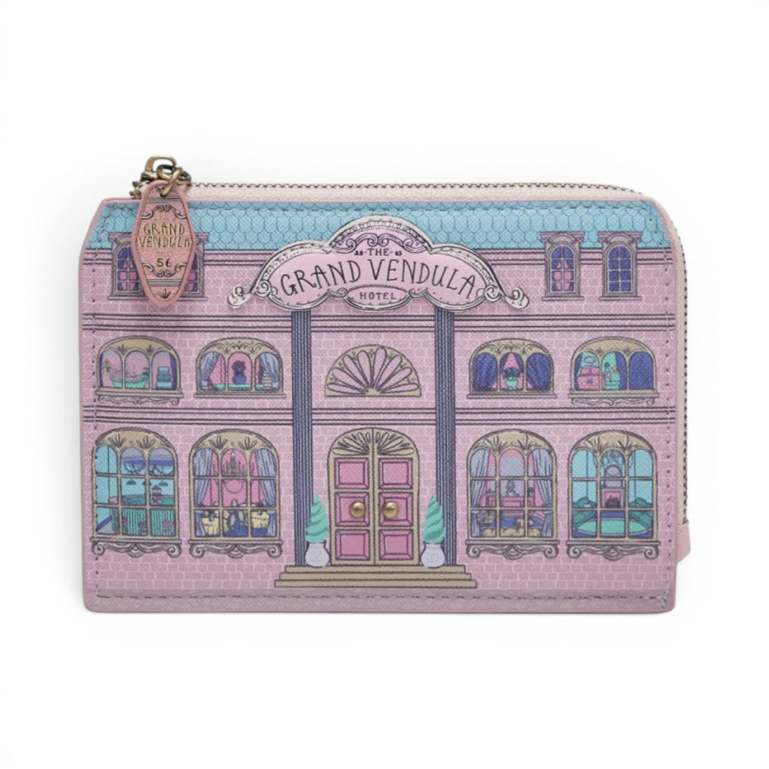 The Happy Shoe Shop Grand Vendula Hotel coin purse in pink vegan leather with hotel facade design and zip closure.