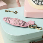 The Happy Shoe Shop Vendula London Grand Vendula Hotel Key Charm, pink vegan leather with embossed lettering and antique gold clip.