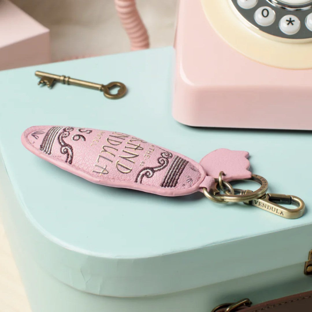 The Happy Shoe Shop Vendula London Grand Vendula Hotel Key Charm, pink vegan leather with embossed lettering and antique gold clip.