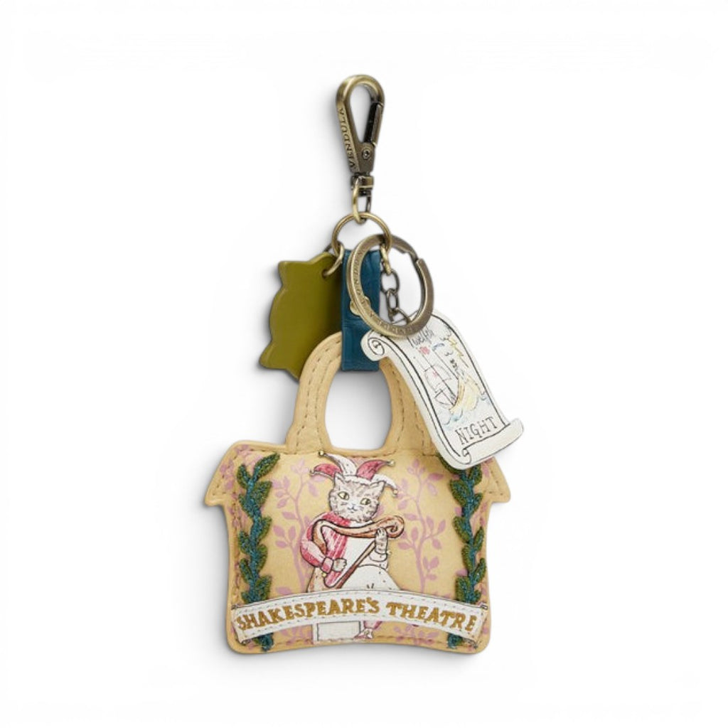 The Happy Shoe Shop Vendula London Shakespeare's Theatre Twelfth Night key charm, a cat in jester costume on a yellow bag with floral print and green trim.